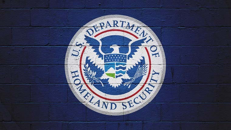 Seal of the Department of Homeland Security painted on a brick wall