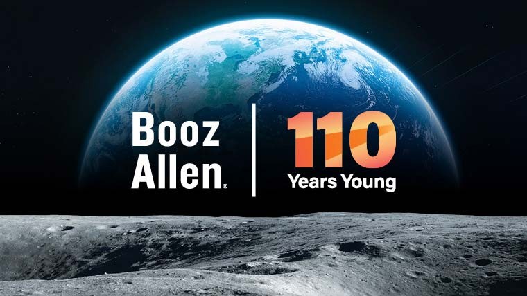 “Booz Allen 110 Years Young” over an image of the Earth as seen from the surface of the moon