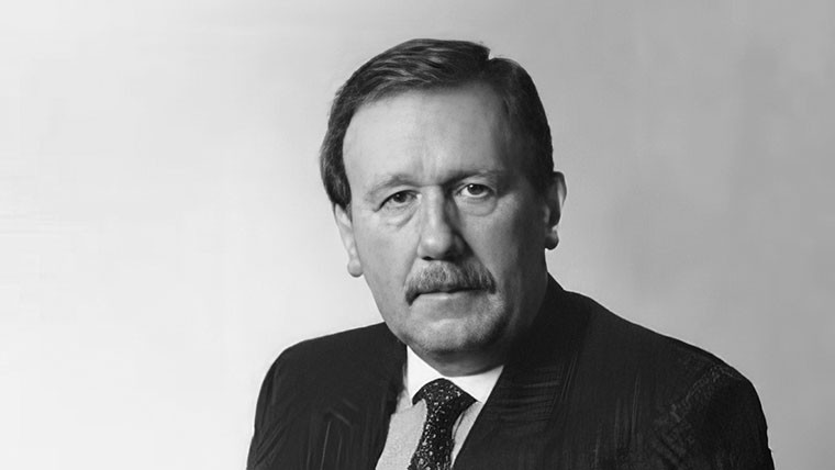 Black & white photo portrait of Keith Oliver in a suit